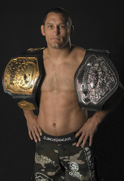 Dan Henderson Holding Pride Fighting Championship Belts.
