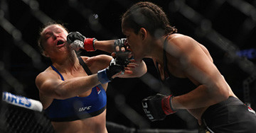Amanda Nunes Lands A Punch On Ronda Rousey.