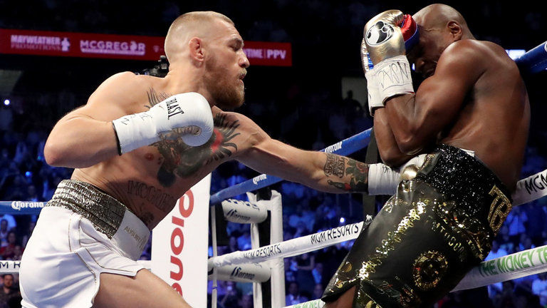 Floyd Mayweather And Conor Mcgregor Exchange Punches.