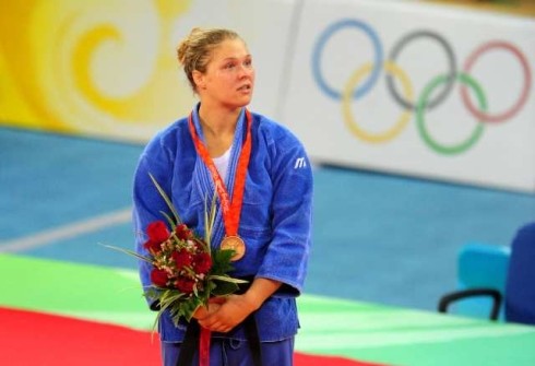 Rinda Rousey With Her Gold Medal From Olympics.