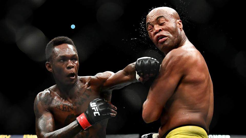 Israel Adesanya Lands A Left Punch On Anderson Silva In Their Fight.