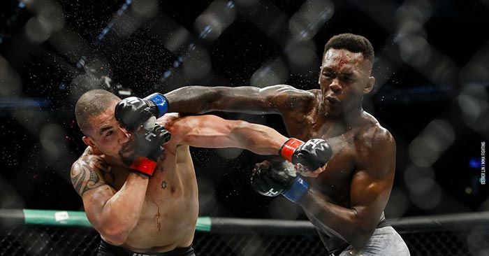 Israel Adesanya Lands A Right Hand On Robert Whittaker At Ufc 243 In Melbourne