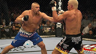 Tito Ortiz Avoids A Punch From Chuck Liddell At Their Fight During Ufc 47.