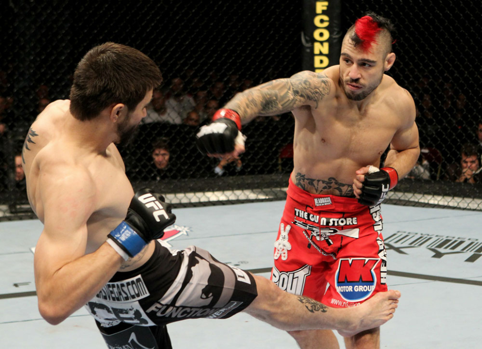 Carlos Condit And Dan Hardy Fighting In The Ufc.